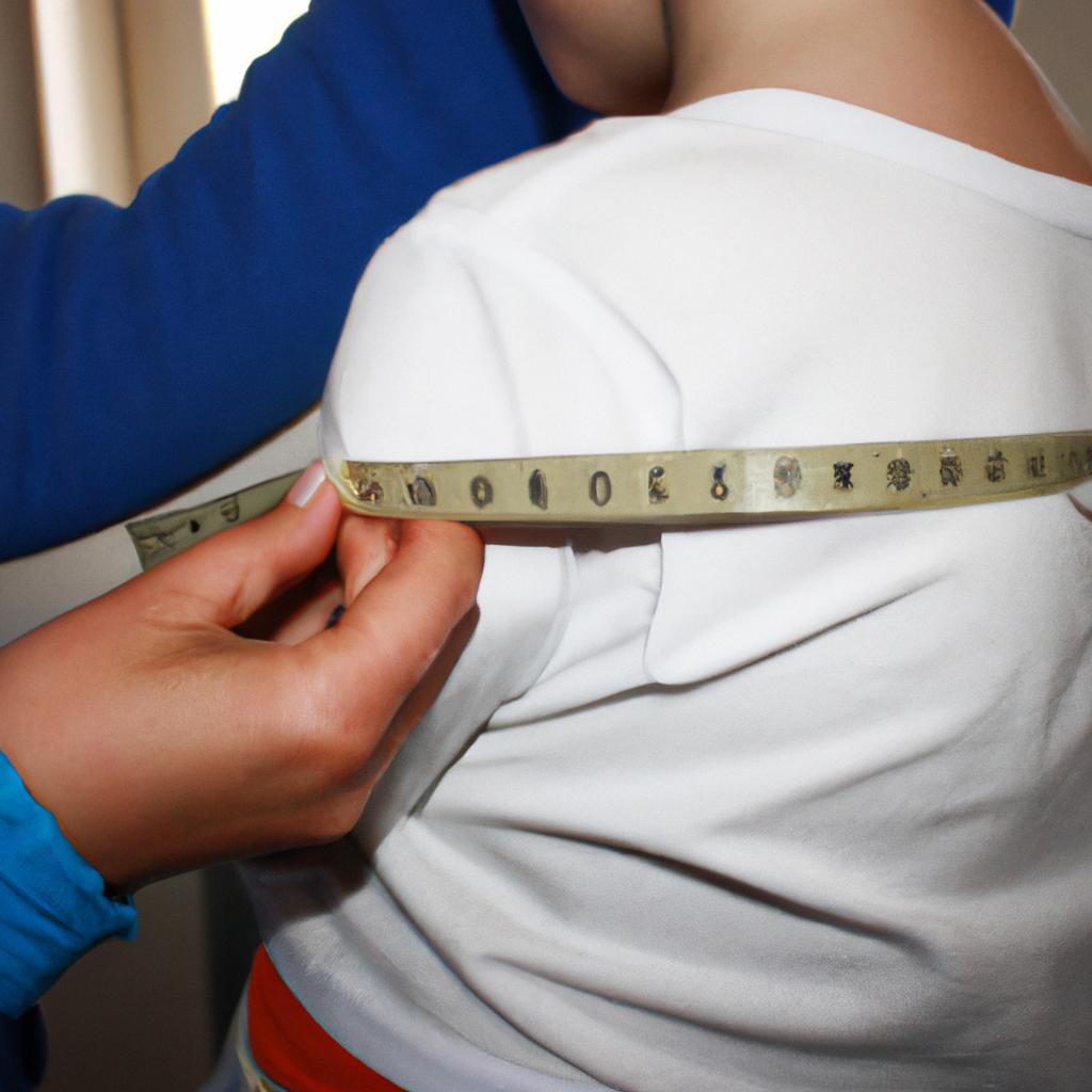 Person measuring child's waist