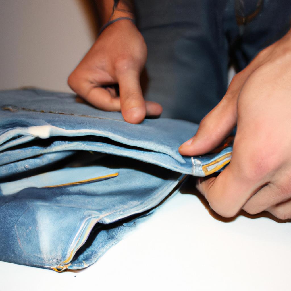 Person folding jeans, giving tips