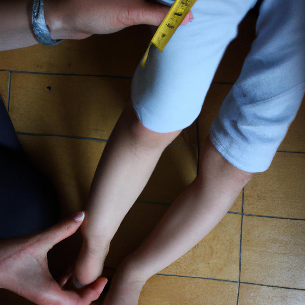 Person measuring child's leg length